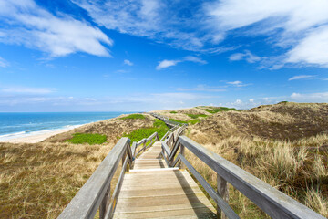 Fototapeta na wymiar wooden stairway to the beach