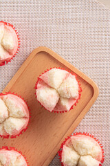 Cute Chinese steamed sponge cake - Fa Gao on wooden table background for spring festival celebration food.