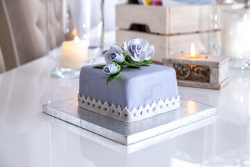 Beautiful decorated fruit cake with blue roses