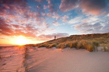 peaceful morning at the beach with lighthouse