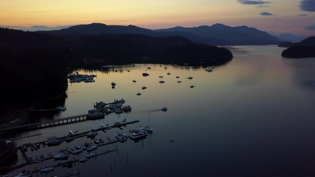 Silhouettes In Marina Port Of Sechelt Inlet During Sunset In Sunshine Coast, British Columbia, Canada. Aerial Shot