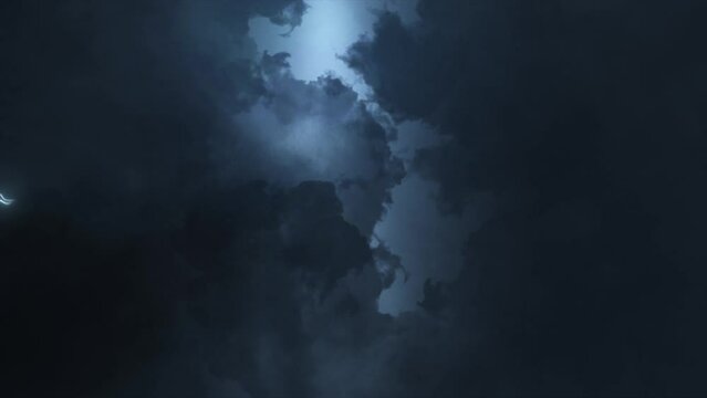 Thunderstorm clouds at night with lightning Electrical Storm strikes black background. Thunderstorm lightning bolts striking with thunderstorm lightning, torrential thunderstorm light effect.