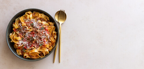 Pasta tagliatelle with bolognese sauce. Italian cuisine. Traditional recipe.