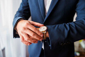 Time is money. Businessman pointing on watch. Business concept