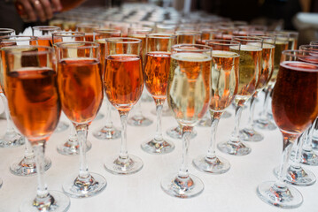 Glasses of red, rose and white wine with sunshine shadow effect. Concept of wine tasting. Flat lay, top view.