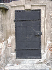 Metal Door in Old Brick and Cement Building in Europe