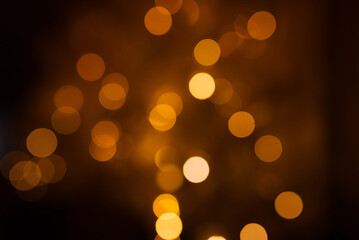 background of abstract gold and black glitter lights. defocused.