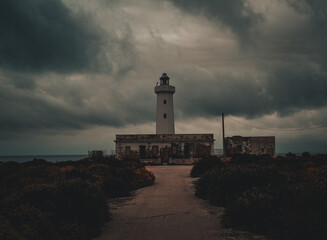 lighthouse in the cliff at dusk