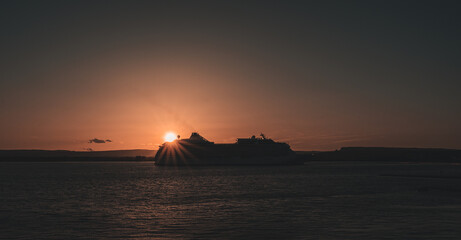 cruise ship in the sunset