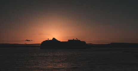 cruise ship in the sunset