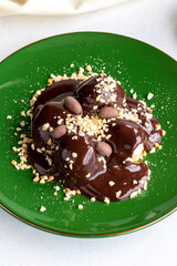 Profiterole on a white background. Profiterole filled with milk cream. Bakery products. close up