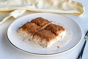 Cold baklava on a white background. Baklava with pistachio milk. Traditional Turkish cuisine delicacies. The new trend is baklava. close-up. local name soguk baklava