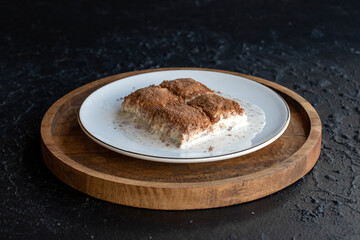 Cold baklava on a dark background. Baklava with pistachio milk. Traditional Turkish cuisine delicacies. The new trend is baklava. close-up. local name soguk baklava
