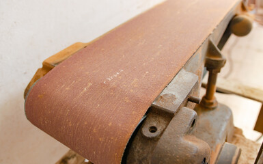 A young man who is working on wood crafts as a hobby.