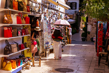 Naklejka premium street in the old town of Kaleici, Antalya. Tourists are walking and shopping