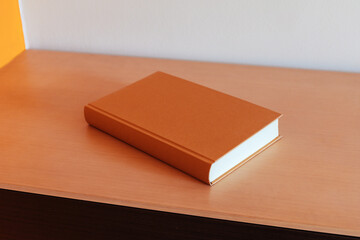 Brown book on a bookshelf