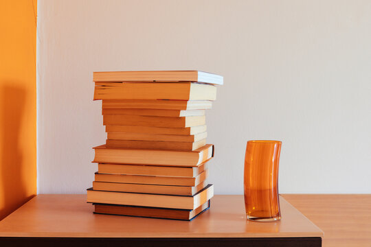 Pile of books on a piece of furniture