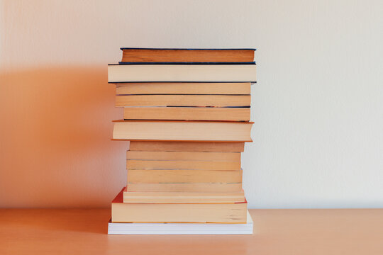 Pile of books on a piece of furniture