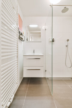 Sink near shower cabin in bathroom