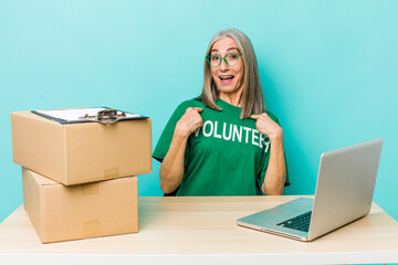 senior gray hair woman feeling happy and pointing to self with an excited. donation volunteer