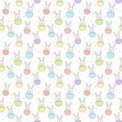 Cute Easter rabbits and eggs. Design of a seamless texture. Vector