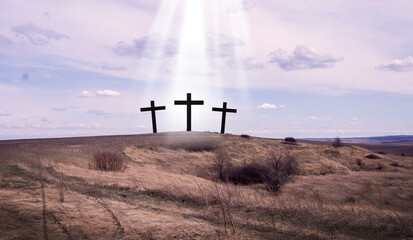 Cross of Jesus. Crucifix against the sky. Easter. Three crosses. Jesus is risen.