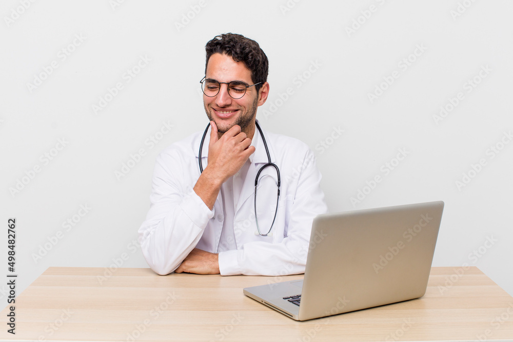 Poster hispanic handsome man smiling with a happy, confident expression with hand on chin. physician concept