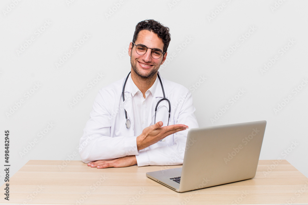 Wall mural hispanic handsome man smiling cheerfully, feeling happy and showing a concept. physician concept