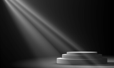 white cylinder stand in the dark studio room	