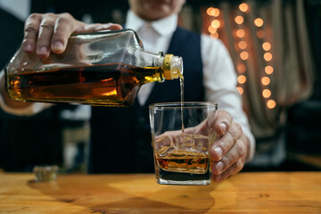 Barman pouring whiskey whiskey glass beautiful night