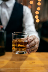 Barman pouring whiskey whiskey glass beautiful night