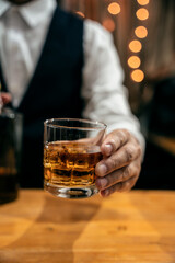 Barman pouring whiskey whiskey glass beautiful night