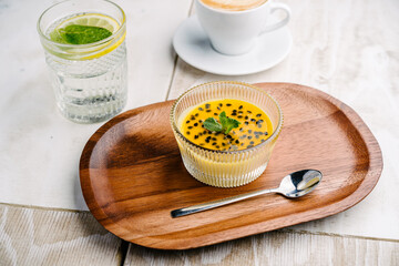 panna cotta with mango and passion fruit sauce
