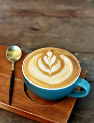 Hot latte cup on wooden table