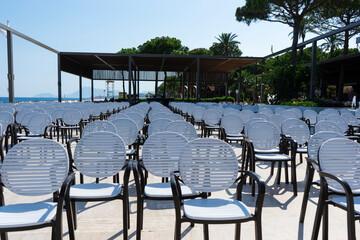 Rows of chairs standing in the open air, concert area