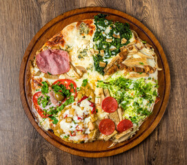 Assorted handmade Argentinian pizza on stone background