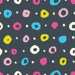 Simple seamless pattern with circles on a black background.