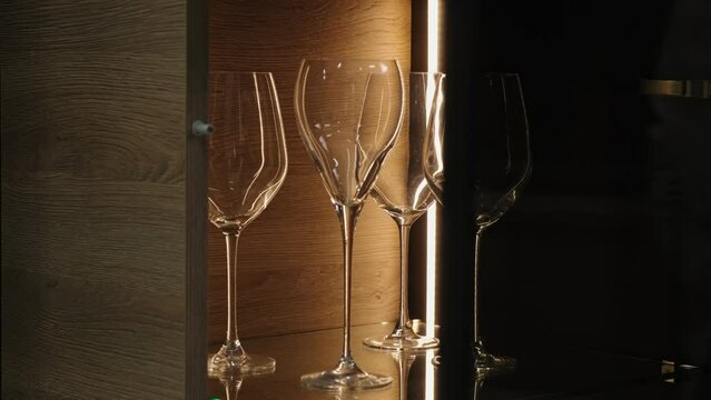 Transparent sideboard with wine glasses
