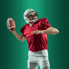 American football sportsman player with ball in action on gradient multicolored neon background,...