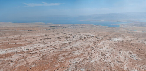 The magnificent gorgeous panoramic aerial view to the Dead sea from Masada fortress in Negev desert, Israel. The concept of environmental and photo tourism. Jordan mountains on the background
