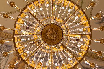Glass design elements of round vintage chandelier