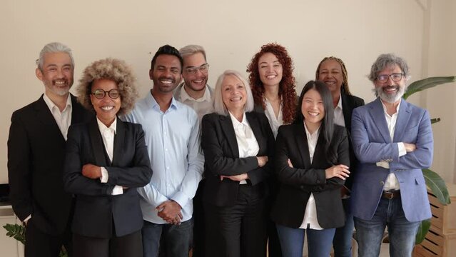 Multiracial generational bank office: Successful business team smiling on camera
