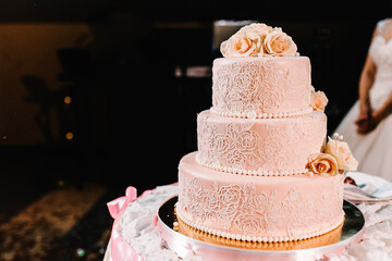 Obraz na płótnie Canvas Wedding cake with flowers for a wedding banquet. Delicious reception. Copy space. Celebration party concept. Trendy Cake.