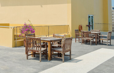 Picnic tables and chairs in the hotel seating area.