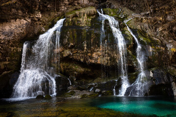 Fototapeta premium Alpine Waterfall with Green lagoon in Beautiful Autumn Season - Waterfall Virje - Bovec, Slovenija