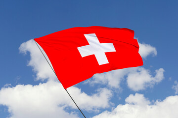 3d illustration. A beautiful view of Switzerland flag on a sky background.