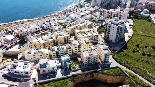 St. Paul Bay cityscape and deep building foundation nearby. Malta island. Aerial view
