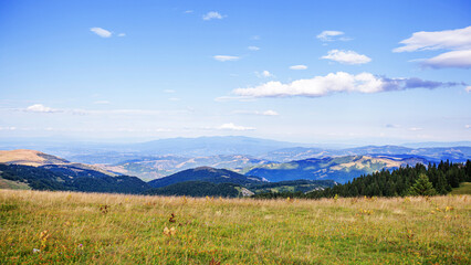 Visually Attractive View of Summer Countryside Mountain Nature Landscape. Picturesque Scenery Green Hills And Fields. Beautiful Blue Sky With Clouds. Mountain Kopaonik, Serbia, Europe.