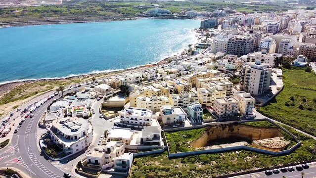 Exotic coastal town of St. Paul Bay with beautiful buildings on sunny day, aerial view
