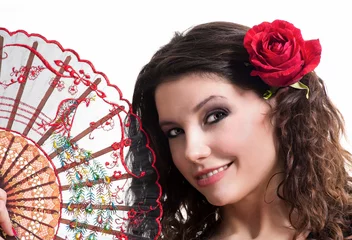 Schilderijen op glas Flamenco dancer with a fan and rose in hair © Fyle